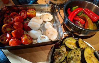 A pan of roasted vegetables on a table.